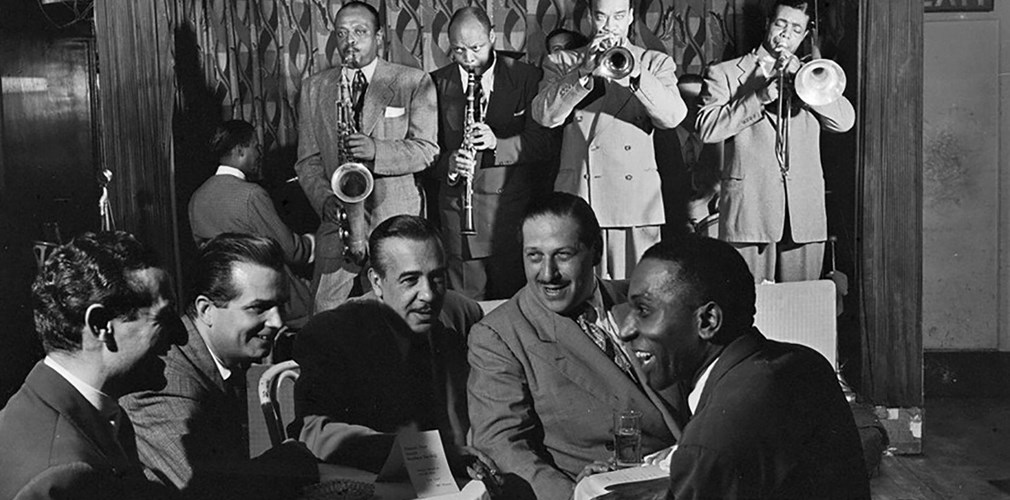 Portrait of Ben Webster, Eddie (Emmanuel) Barefield, Buck Clayton, Benny Morton, Joe Marsala, and Cozy Cole, Famous Door, NY